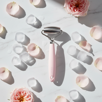 Gently glide the ice roller over the face using upward and outward movements. 